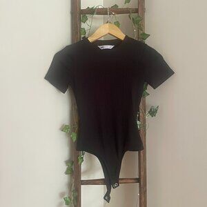 Black Ribbed Bodysuit – Short Sleeve Snap Bottom